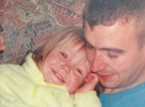 David Haines as a young dad with his baby daughter Bethany