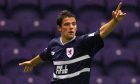 Nach Novo celebrates scoring a goal during his playing days with Raith Rovers.