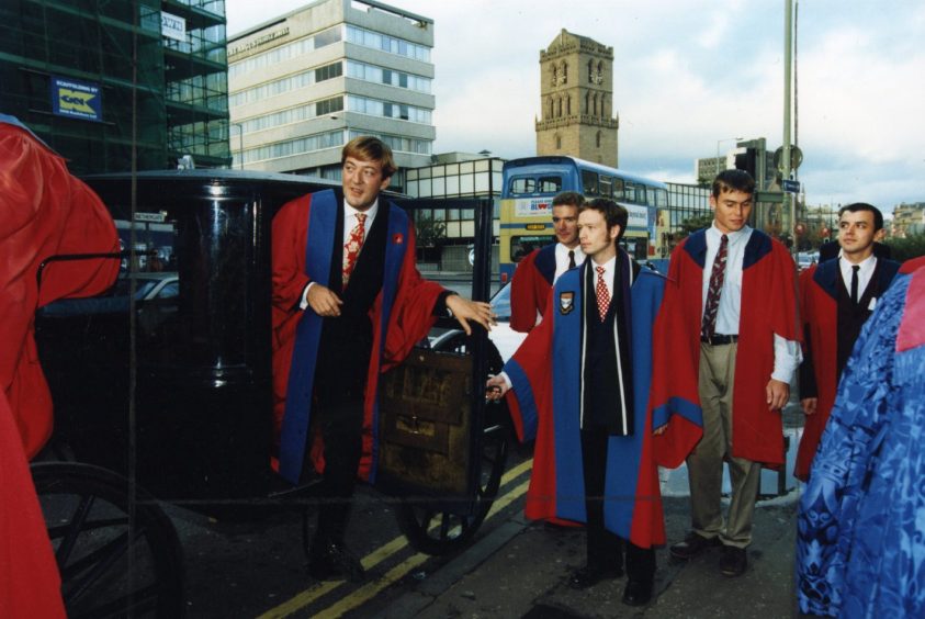 Stephen Fry steps out of a carriage before being reinstalled as rector of the University of Dundee in 1995.