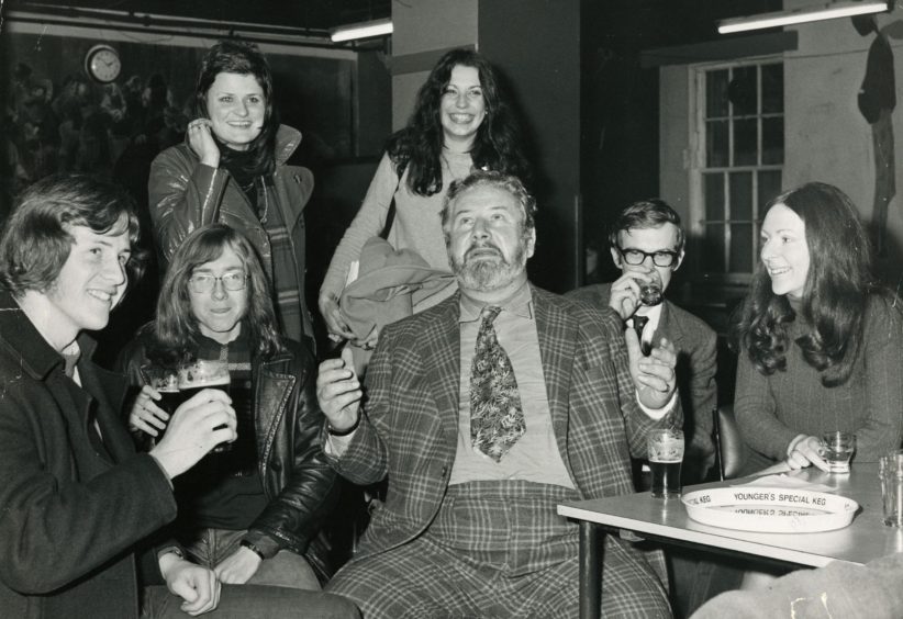 Rector Peter Ustinov talking with some of the students while they have a drink