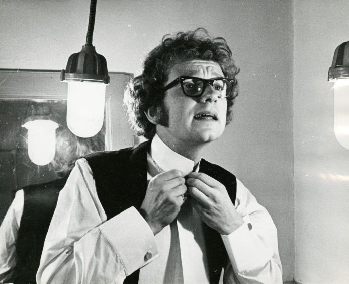 McDiarmid fixes his tie in the dressing room before a role in The Wild Duck at Lyceum Theatre in 1969. 