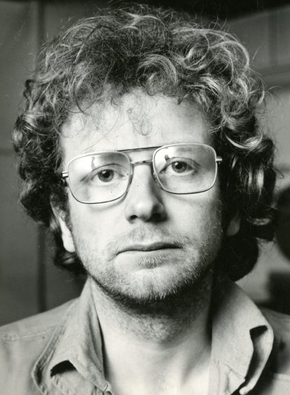 A head and shoulders shot of McDiarmid, wearing glasses, after returning from Italy in 1972.