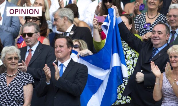 Alex Salmond celebrates as Andy Murray won his first Grand Slam title in 2013. Image: SNS