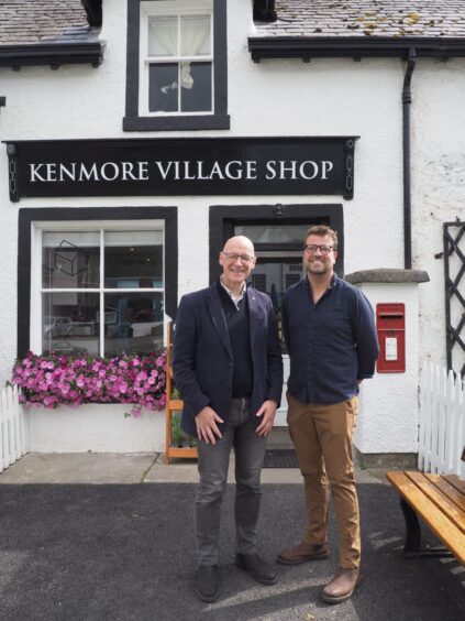 John Swinney standing outside Kenmore village shop with Chris Rowley