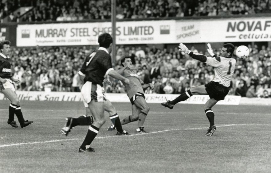 Maurice Malpas scores the first goal for United.