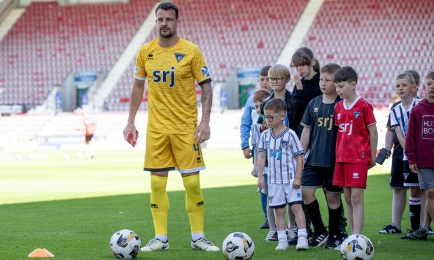 Dunfermline captain Kyle Benedictus with young fans at the open training session.