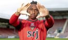 Tobi Oluwayemi reaches his hands out to the camera.