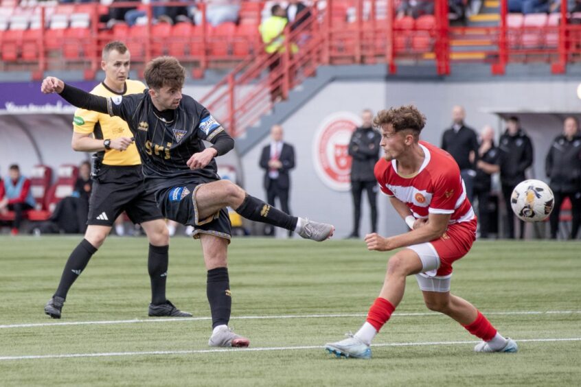 Josh Cooper shoots at goal during his debut for the Pars.