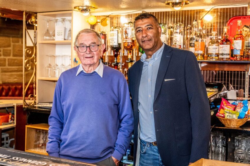 George McIntosh and Raj Joshi behind the Victoria Inn bar