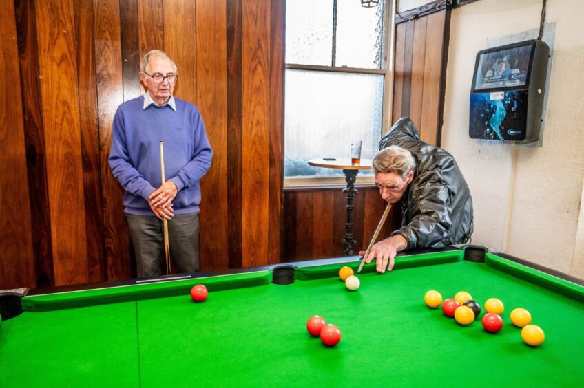 George McIntosh watching Russel Fleming play pool at the Victoria Inn, Coupar Angus