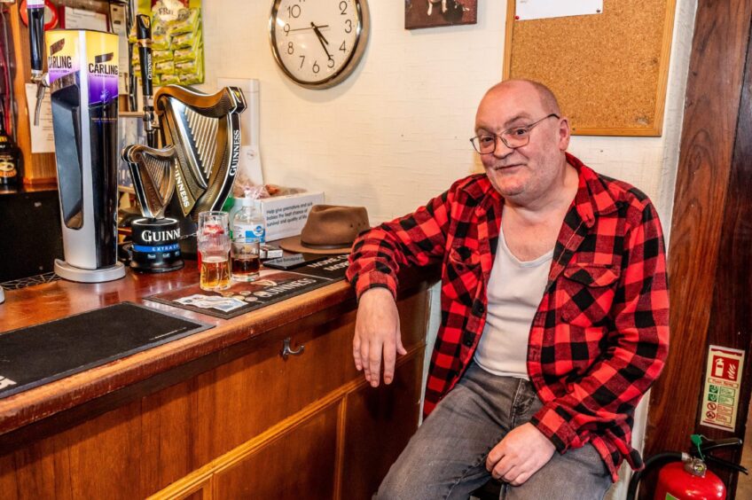 Ian Forsyth seated at Victoria Inn bar