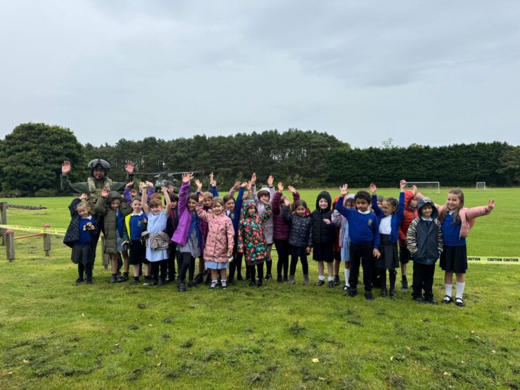 Some of the pupils with the Chinook pilot.