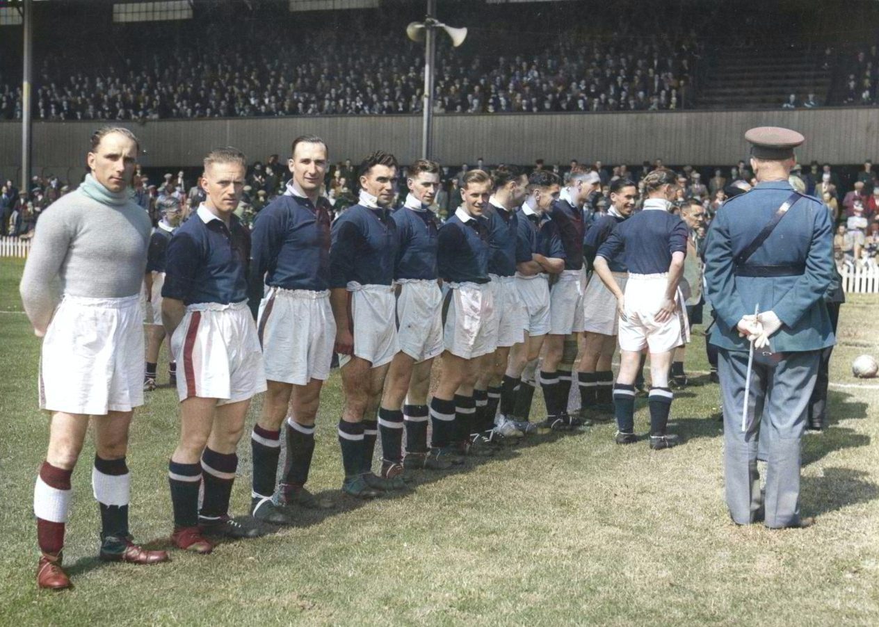 Dundee FC players lined up on the pitch to meet the Lord and Lady Provost