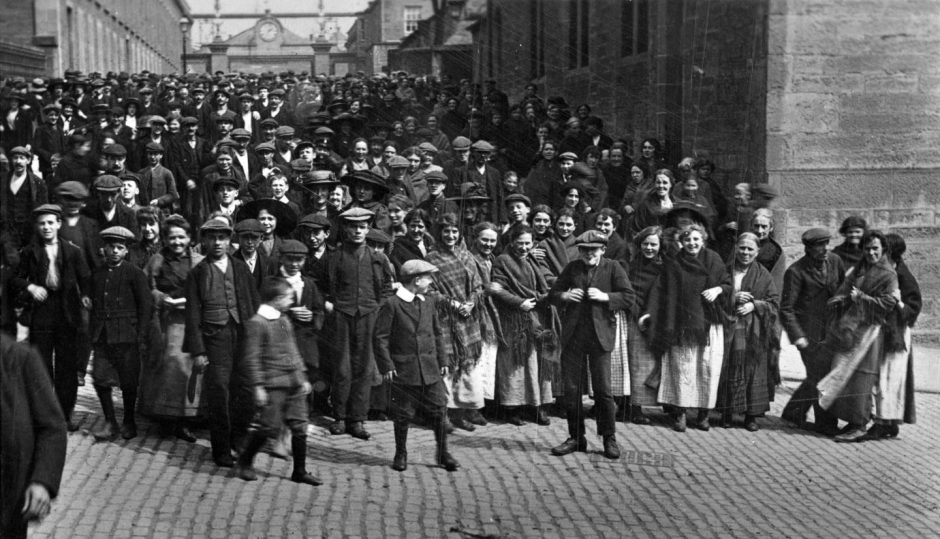 workers gather for a photograph outside Camperdown Works, which was the city's most famous industrial complex.