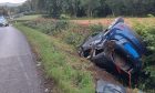 The car in a ditch on the A923 near Pitcur. Image: Road Policing Scotland/X