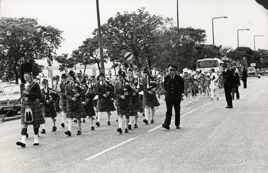 A pipe band taking part in the Dundee Festival parade in 1981.