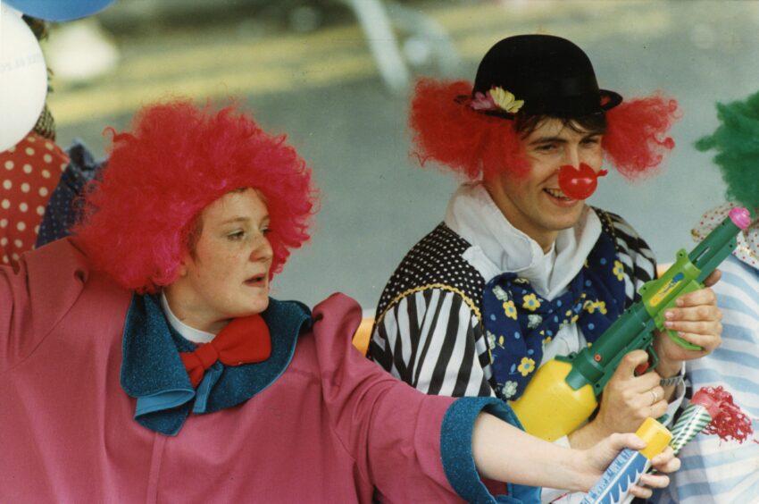 Two individuals dressed as clowns for Dundee Festival in 1992. 