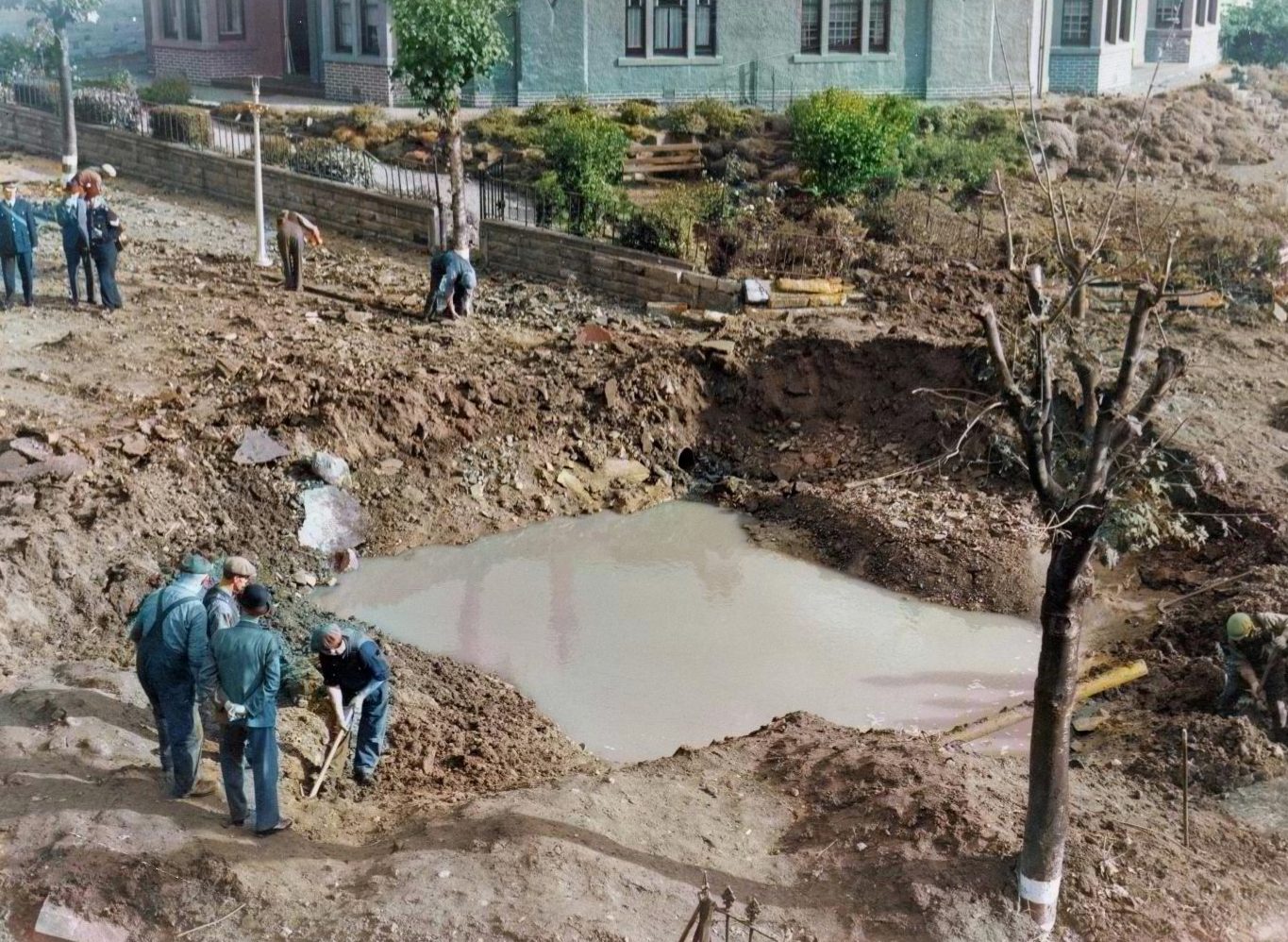 Repair work gets under way at Dalkeith Road, scene of a huge bomb crater 