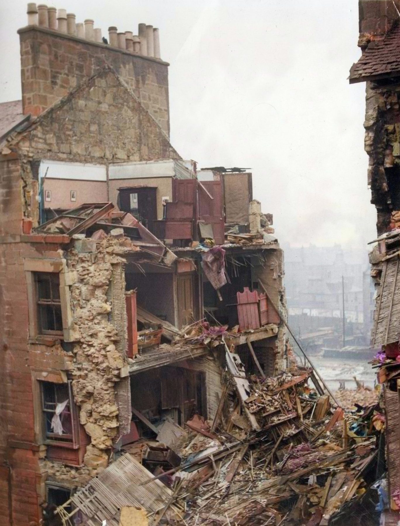 The damaged Rosefield Street tenement block, with rooms and furniture visible amid the rubble