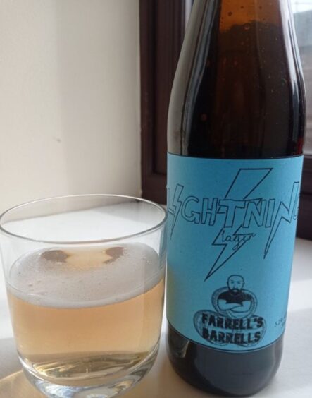 Bottle of lager with hand drawn Farrell's Barrell's logo