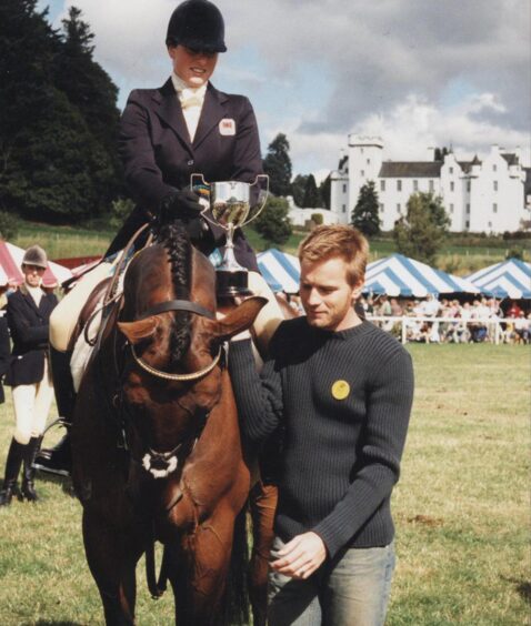 Ewan McGregor presents a trophy to Nicky Roncoroni at Blair Horse Trials in 2001. Image: Supplied by Blair Castle. 