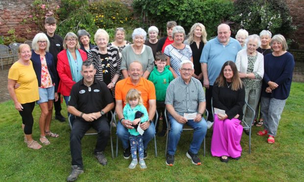 The fundraising friends group with recipients of the charity cheques. Image: Wallace Ferrier