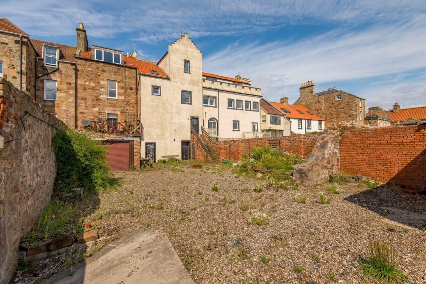 Large garden space leads directly onto the shore.