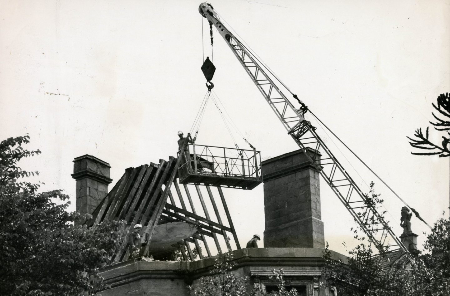 A crane at work as the ceiling is removed in July 1984. 