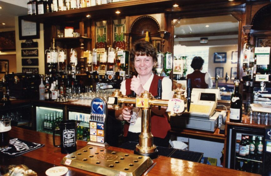 Donna Hood behind the bar in Erskine Lane. 