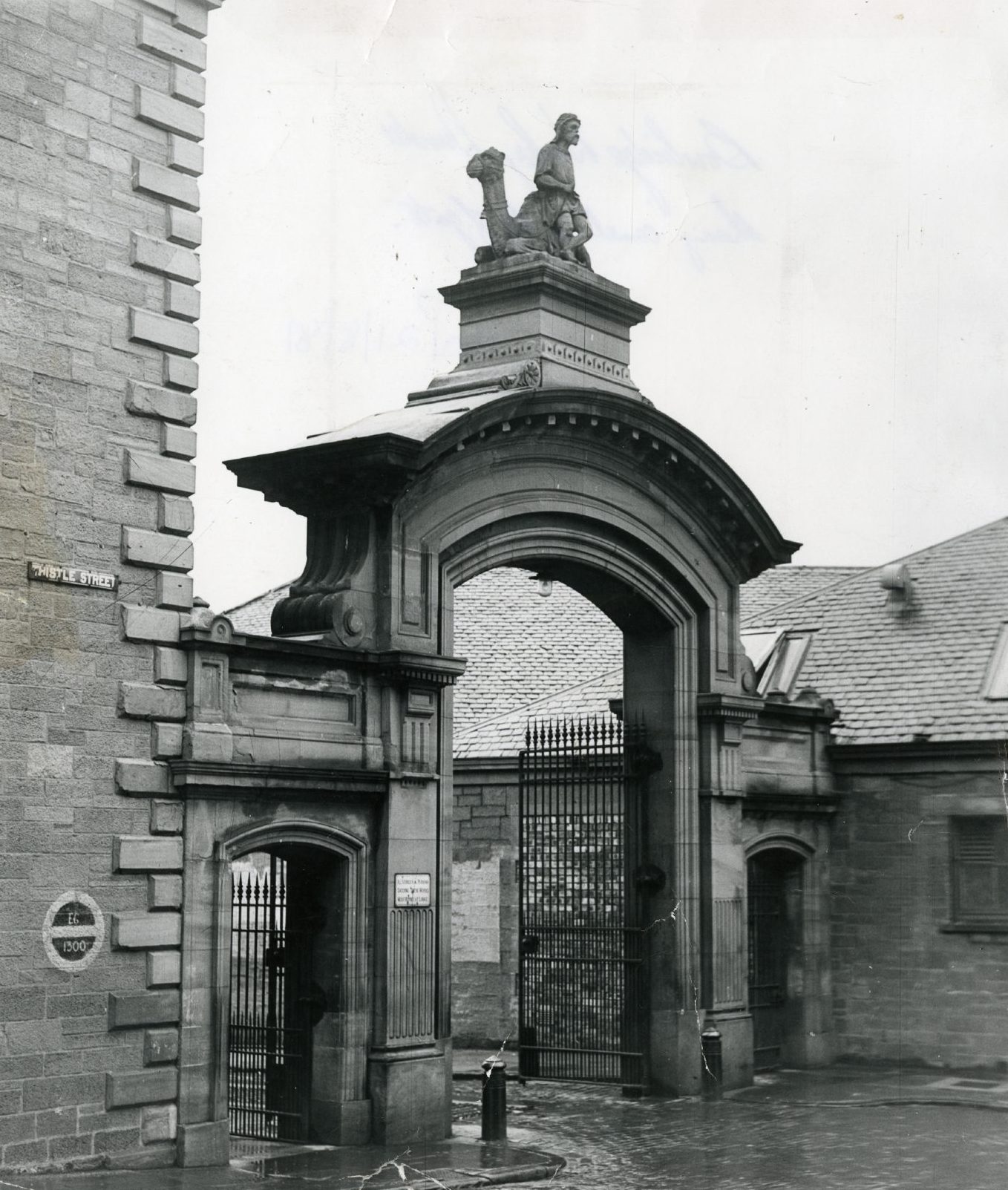 The camel and rider atop the gates before demolition.