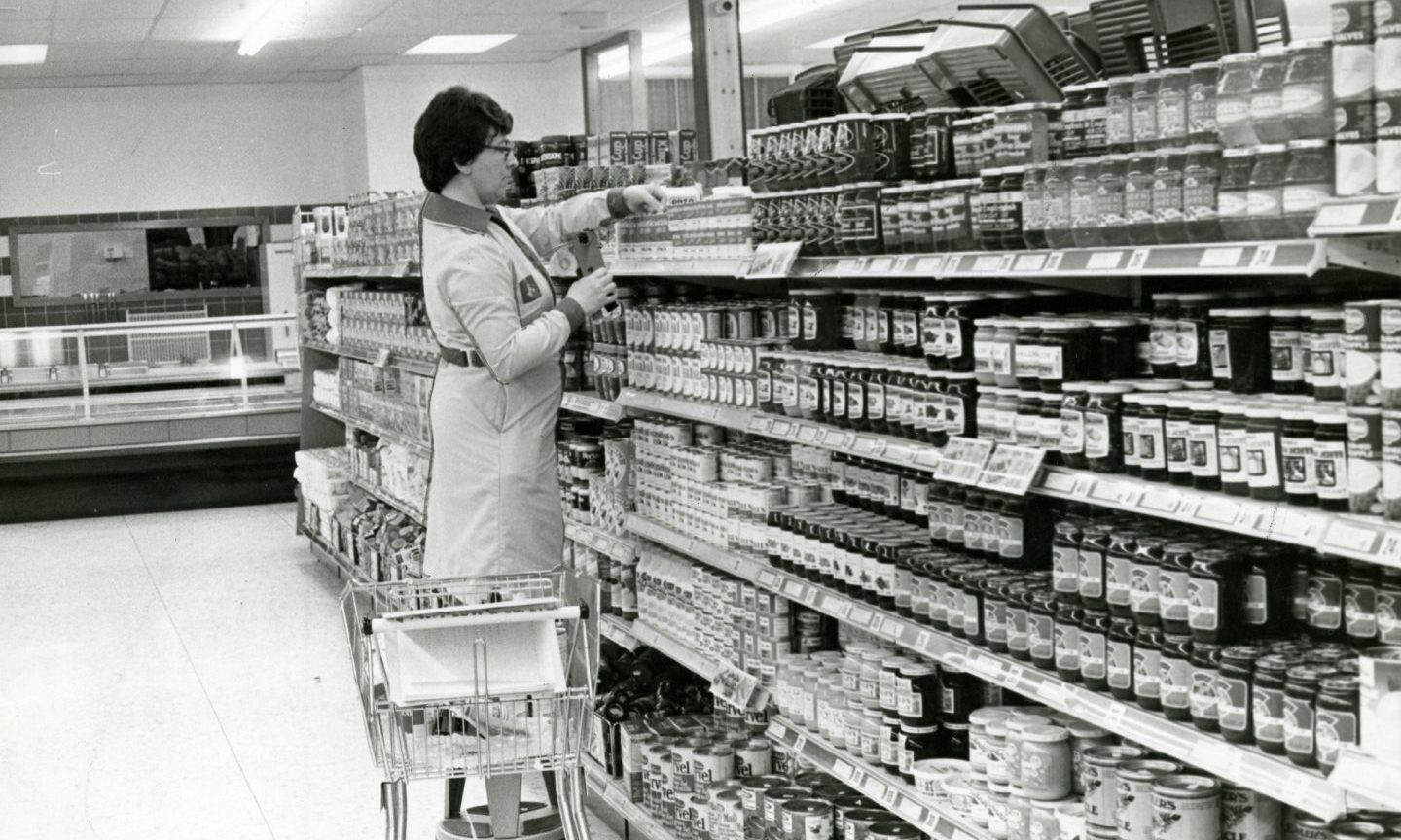 a woman stacking shelves at The William Low store in Perth Road in Dundee in 1979.