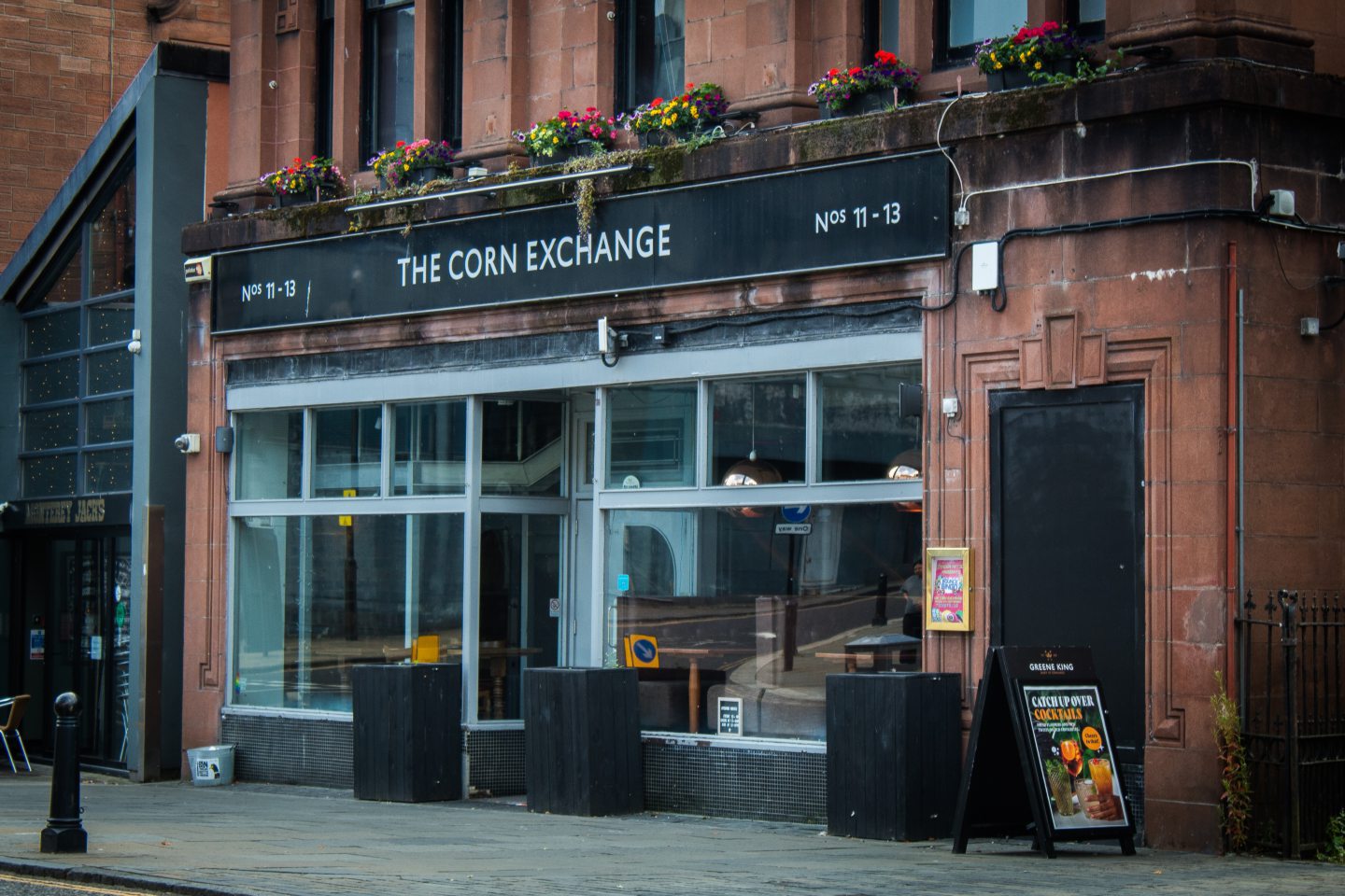 Stirling pub with windows and a sign reading "The Corn Exchange"