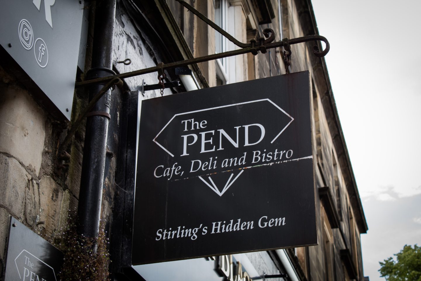 Sign reading 'The Pend: Cafe, Deli and Bistro. 