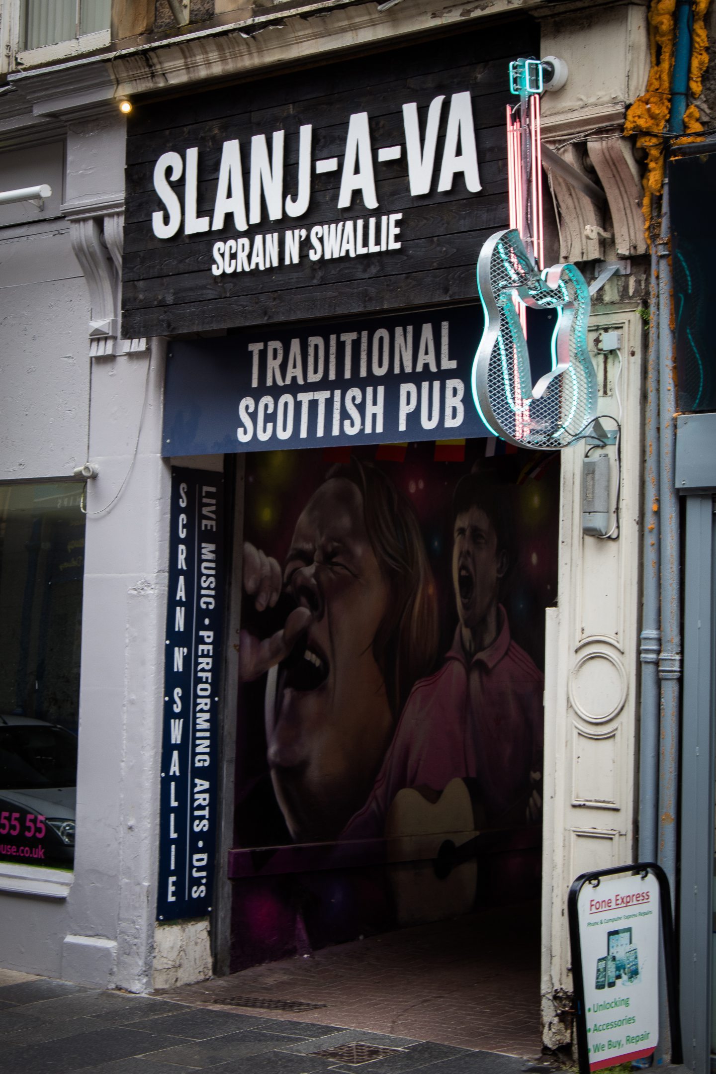 Front of pub. Sign reading 'Slanj-A-Va'