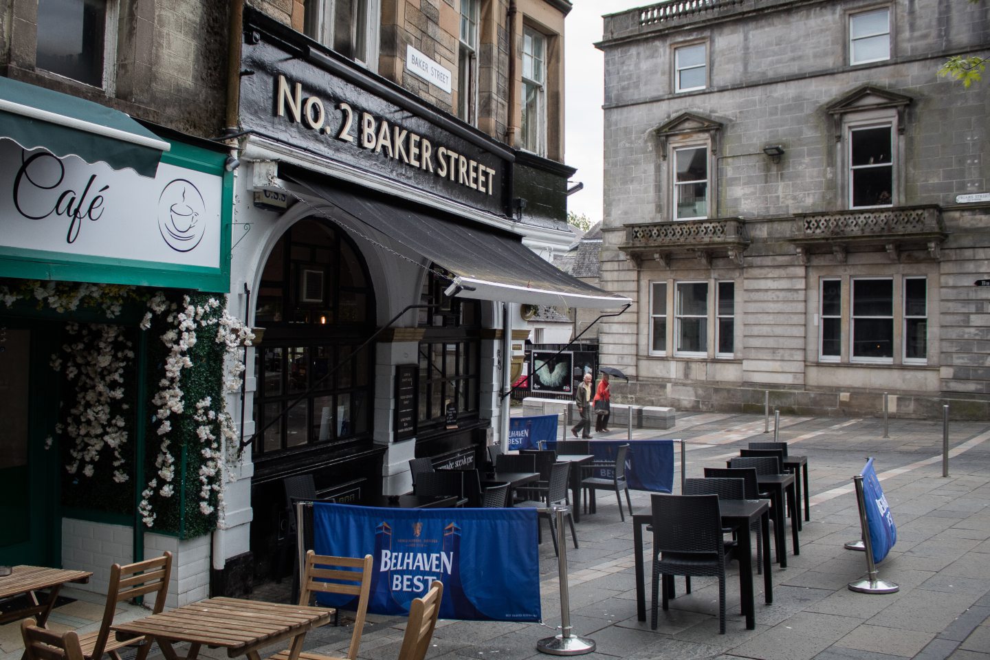 Front of a pub with chairs outside. Sign reads 'No 2 Baker Street'