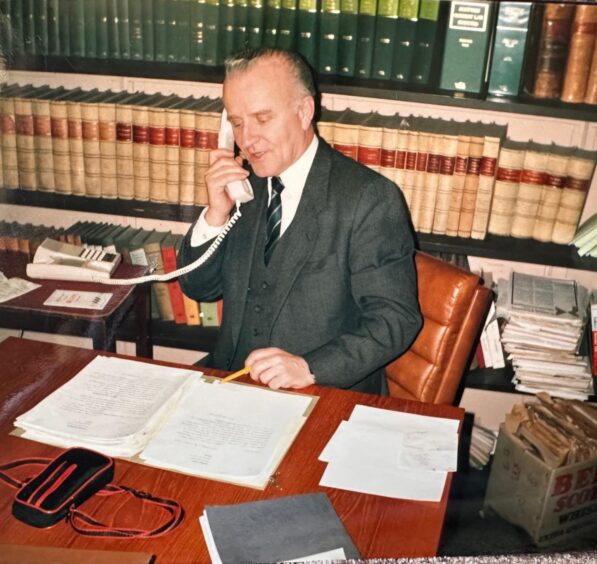 Joe Roberts at his desk - back in the day. Image: Supplied.