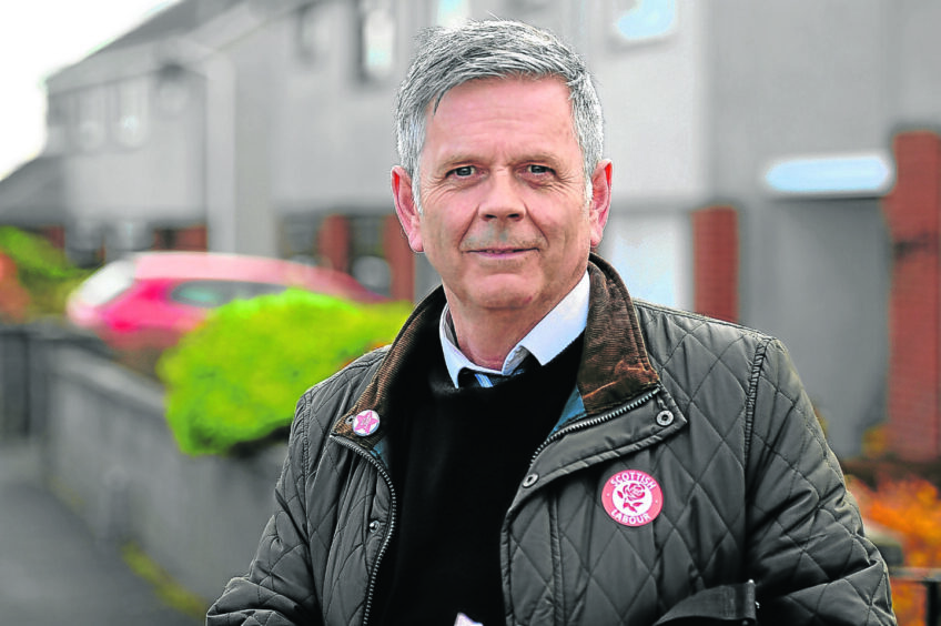 Mr Malone with a Scottish Labour badge 