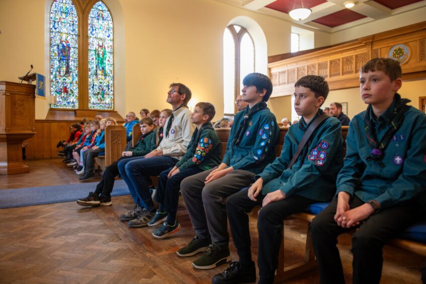 Glamis Scouts historic flag returns home to village hall.