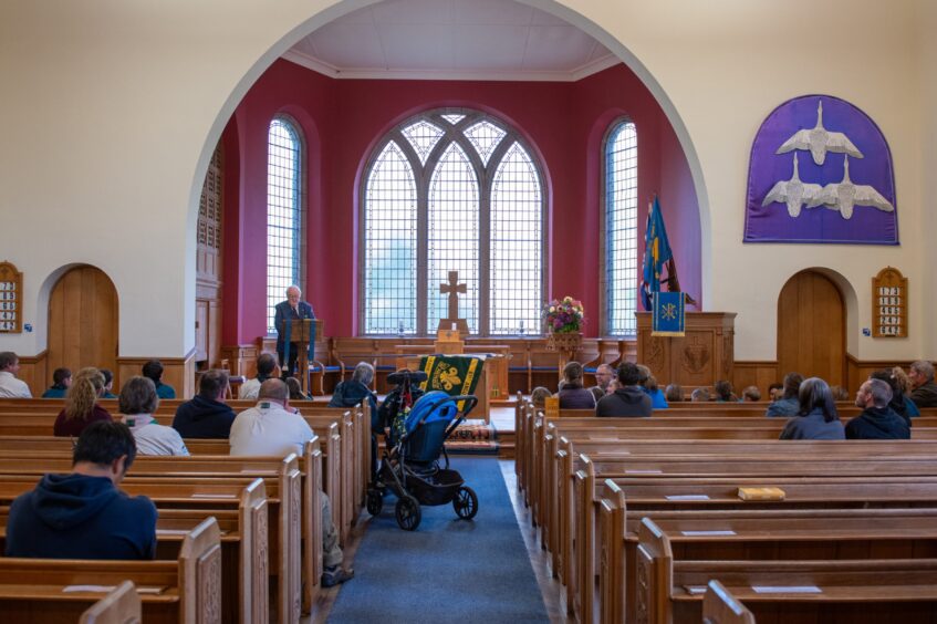 Glamis Scout group flag returns home in historic ceremony.