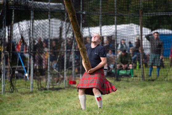 Bruce Robb in the caber tossing at Glenisla Games. Image: Kim Cessford / DC Thomson