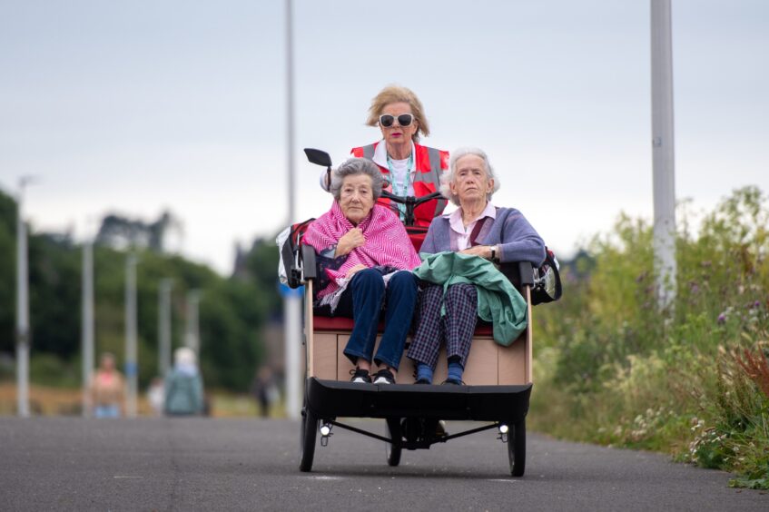 Passenger Pat Terry, Vivien Scott (volunteer) and Sandra Haworth enjoy a trip out on the trishaw from Monifieth.