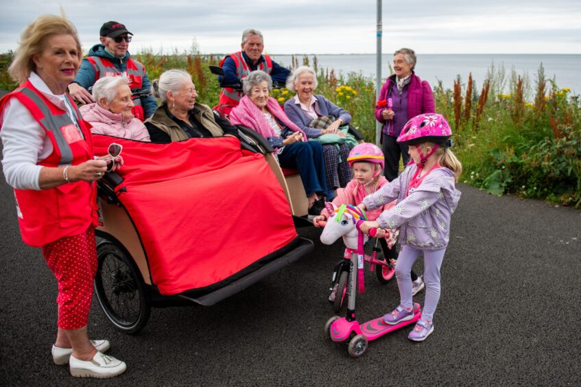 The trishaws generate interest from all ages. Flora Kernohan and her granddaughters - Rowan and Millie Strachan get a close up look.