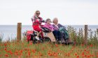 One of the trishaws piloted by volunteer Vivien Scott with passengers Pat Terry and Sandra Haworth. Image: Kim Cessford.