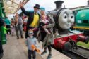 Sir Topham Hatt was on hand to welcome visitors Thomas (3), Mabel (8mths) and Katy Nicoll. Image: Kim Cessford / DC Thomson