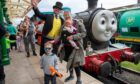 Sir Topham Hatt was on hand to welcome visitors Thomas (3), Mabel (8mths) and Katy Nicoll. Image: Kim Cessford / DC Thomson