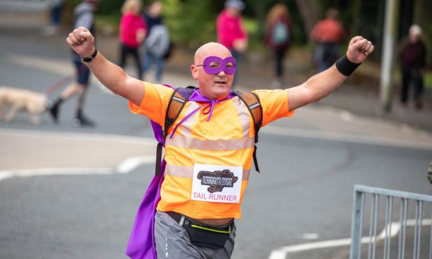 Every half marathon needs a hero -Captain Tail Runner brings up the rear.