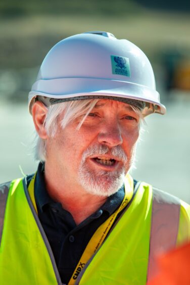 Grant Laing in hard hat and yellow high vis safety gear