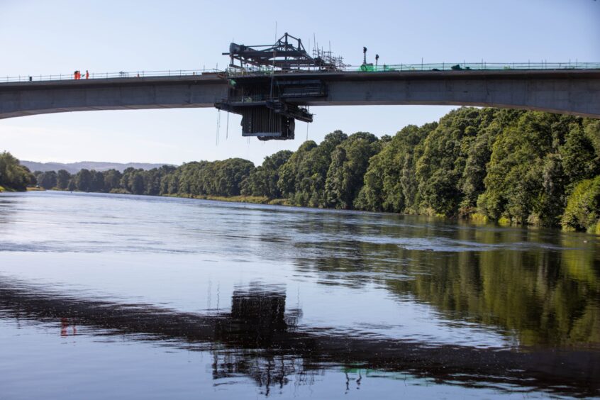 Destiny Bridge, with section in middle with heavy metal scaffolding and machinery