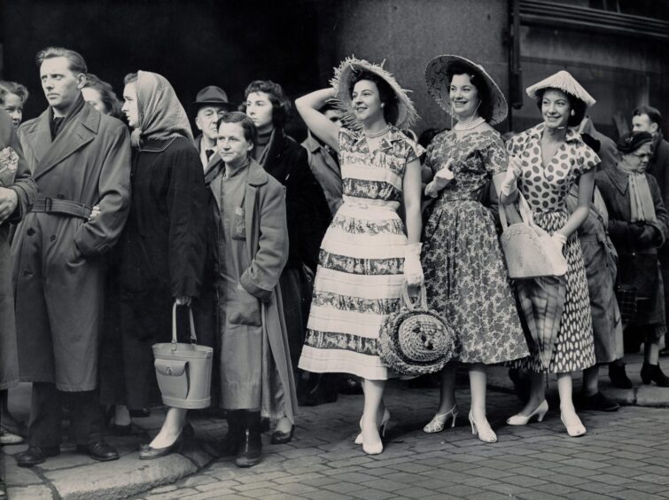 Crowds watch a mannequin parade at DM Brown's in 1957. 