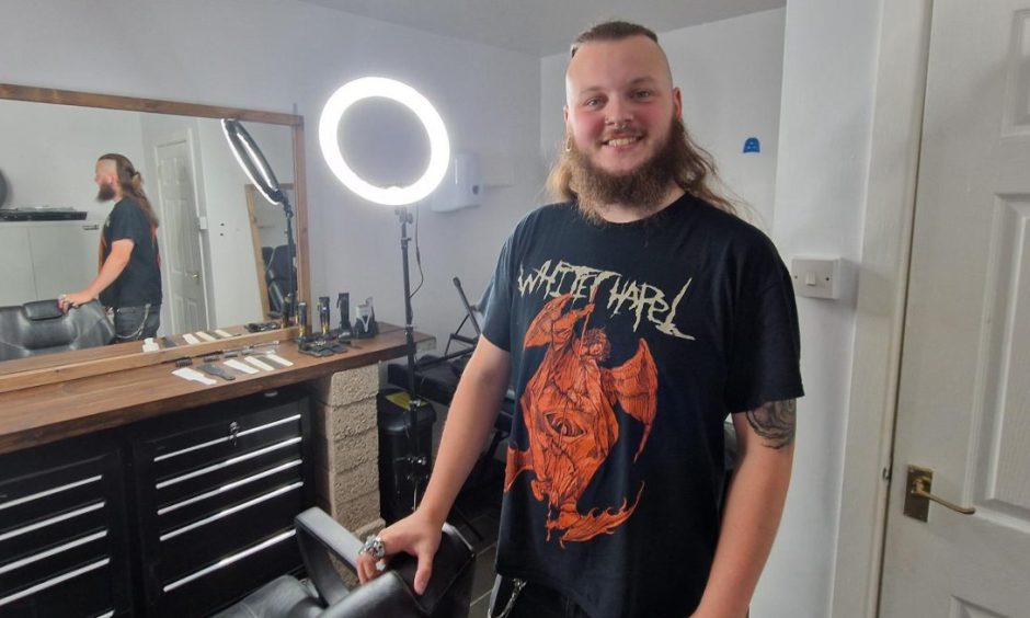 Callan Caddell inside his 'alternative' barber shop.